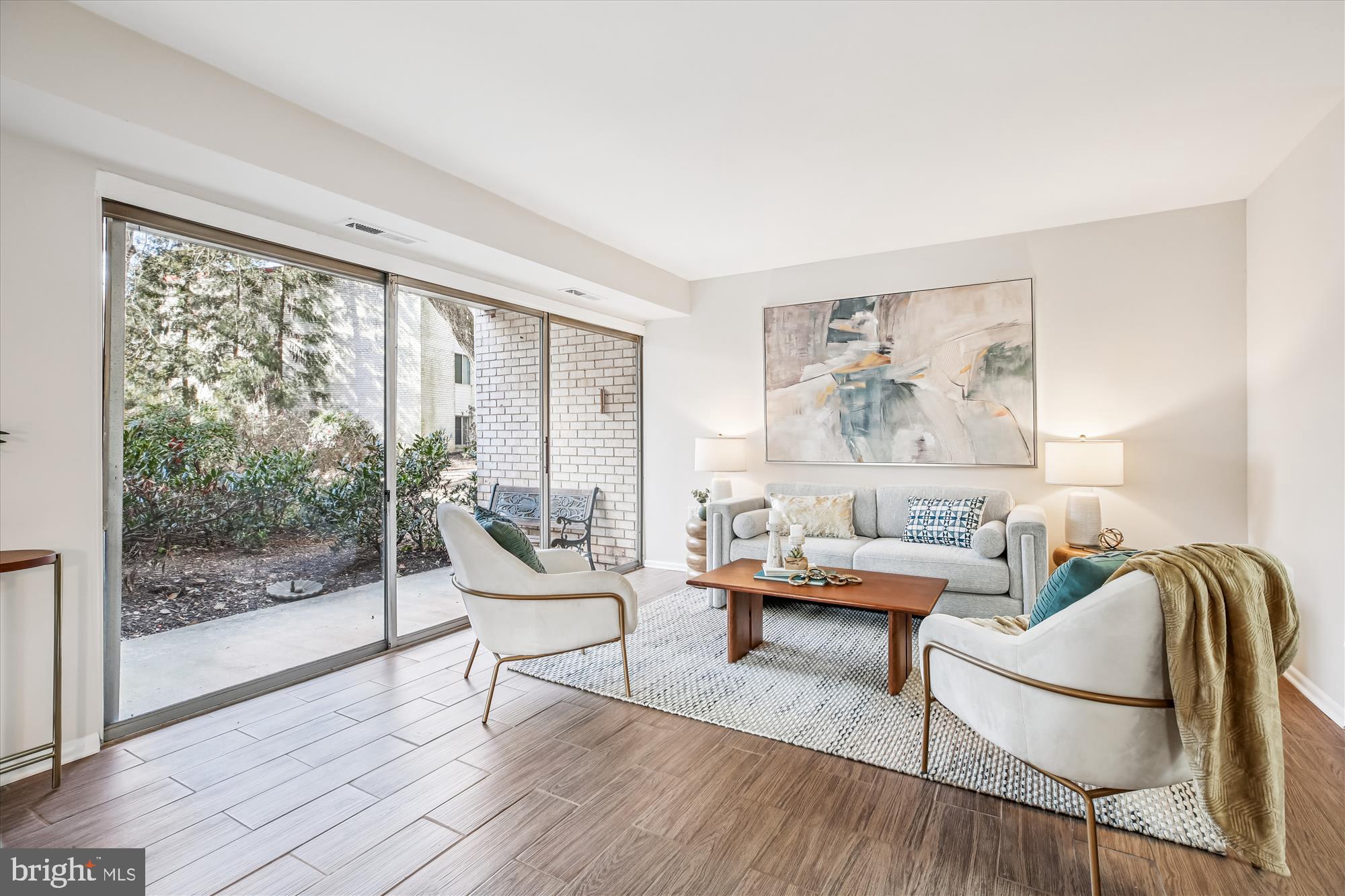 14410 Parkvale Road, Unit 2 Rockville, MD 20853 - Photo 6 of 37 a living room with furniture and a large window
