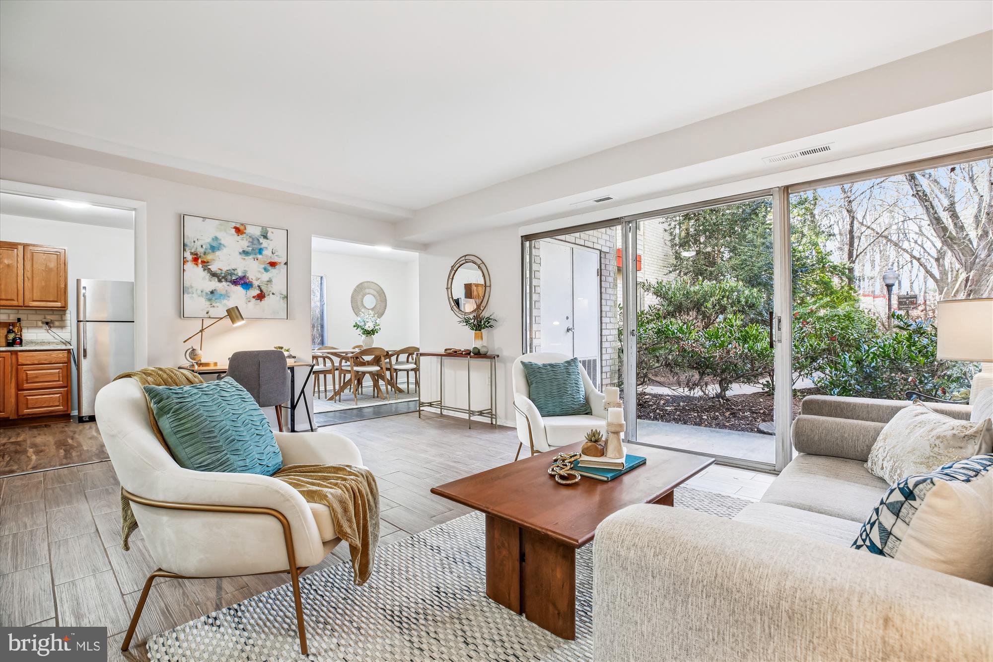 14410 Parkvale Road, Unit 2 Rockville, MD 20853 - Photo 7 of 37 a living room with furniture and a large window