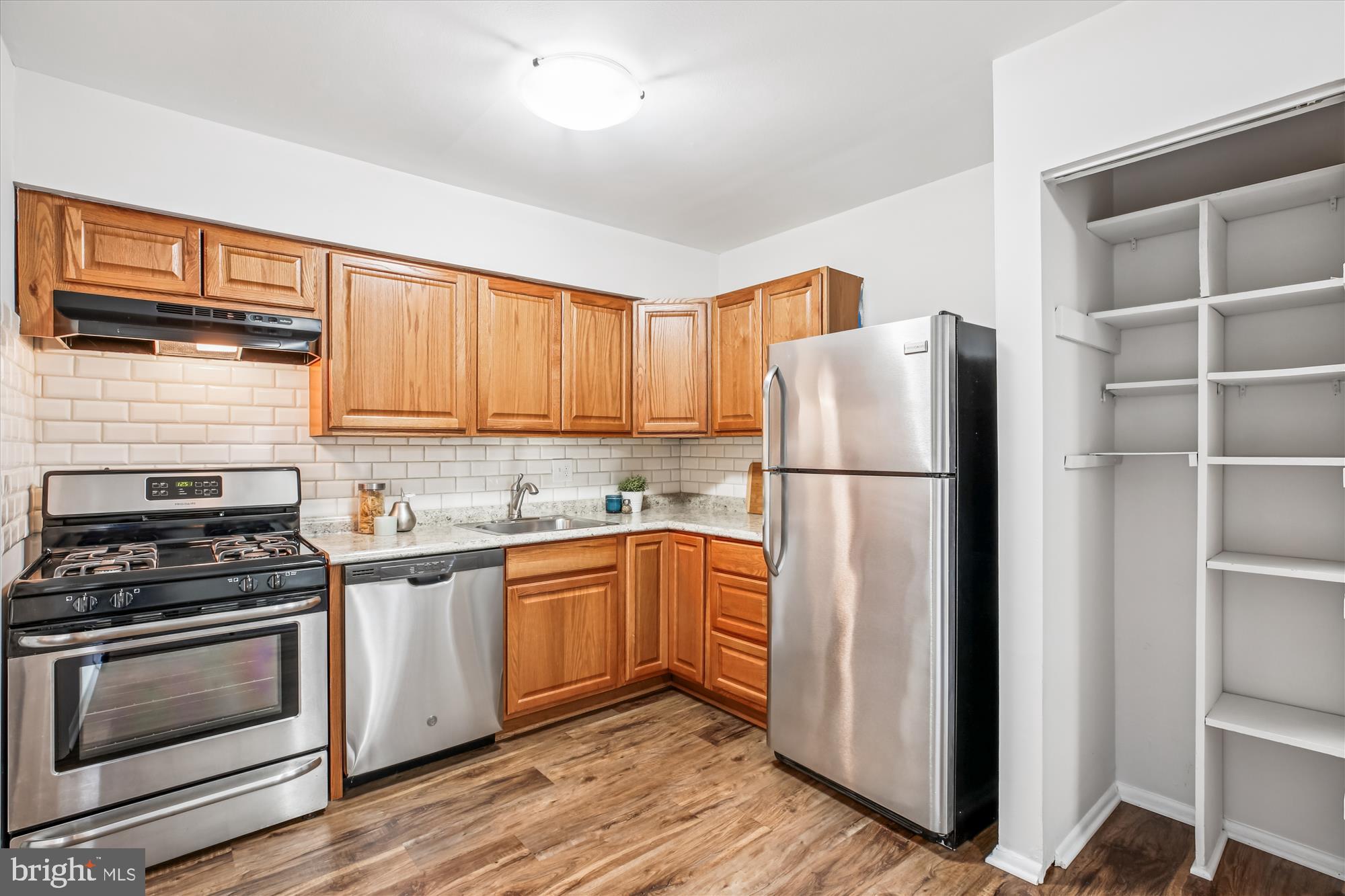 14410 Parkvale Road, Unit 2 Rockville, MD 20853 - Photo 10 of 37 a kitchen with a refrigerator stove and microwave