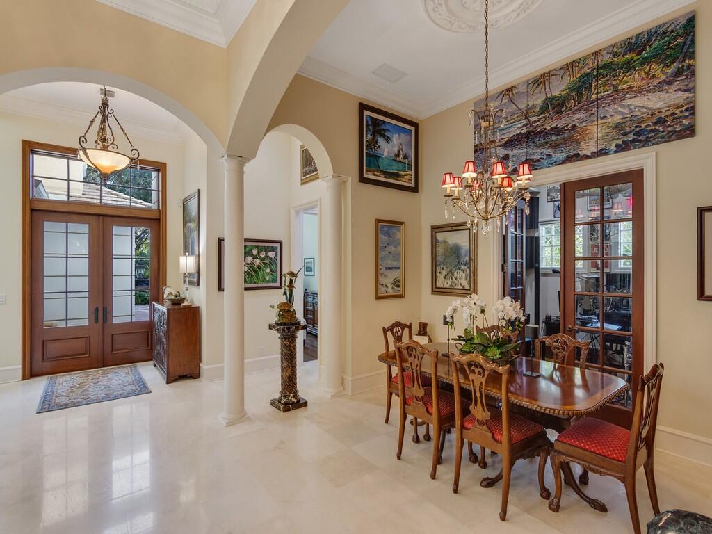 400 Oceanview Lane Vero Beach, FL 32963 - Photo 17 of 59 a view of a dining room with furniture and chandelier