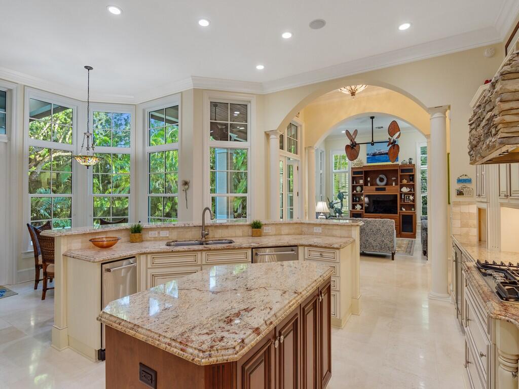 400 Oceanview Lane Vero Beach, FL 32963 - Photo 18 of 59 a kitchen with stainless steel appliances granite countertop a stove and a sink