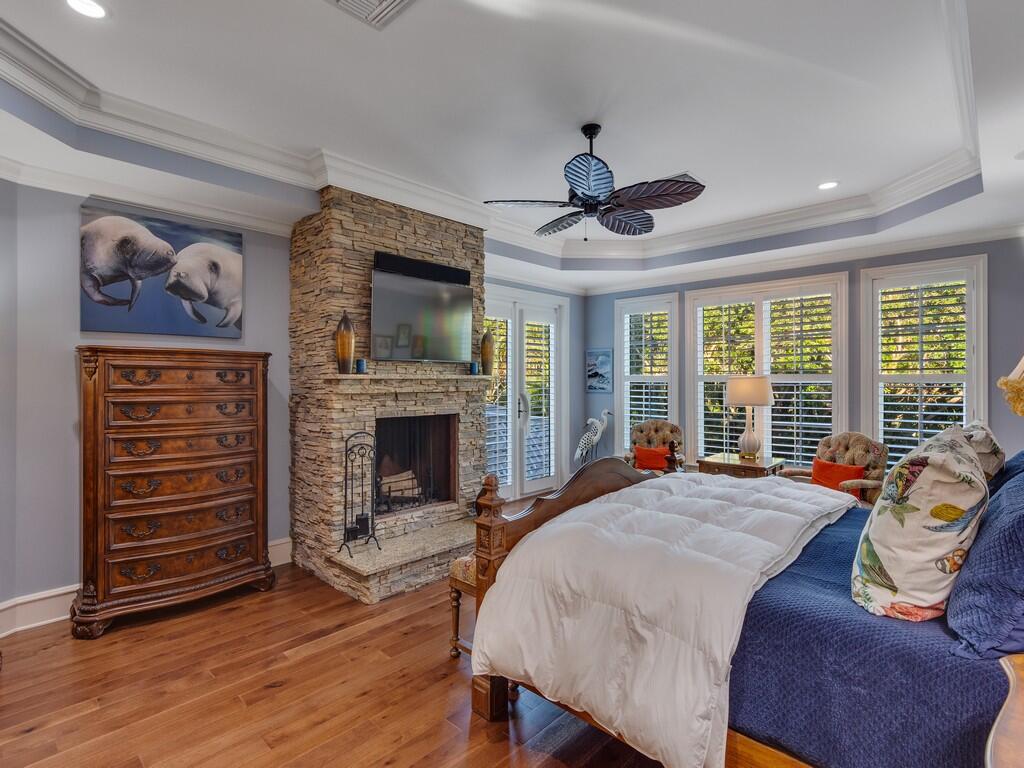 400 Oceanview Lane Vero Beach, FL 32963 - Photo 30 of 59 a spacious bedroom with a bed and a fireplace