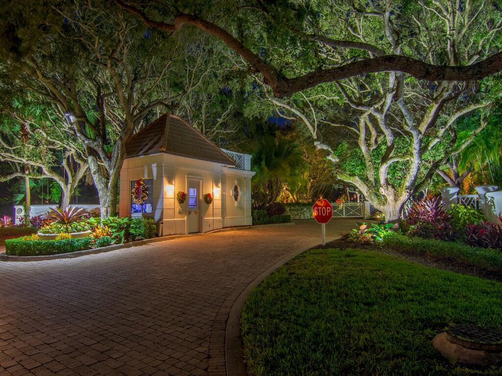 400 Oceanview Lane Vero Beach, FL 32963 - Photo 3 of 59 a view of a white house with a big yard and potted plants