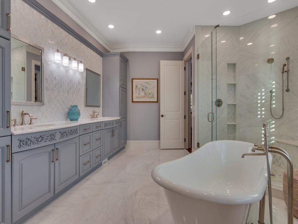 400 Oceanview Lane Vero Beach, FL 32963 - Photo 33 of 59 a bathroom with a double vanity sink mirror and shower