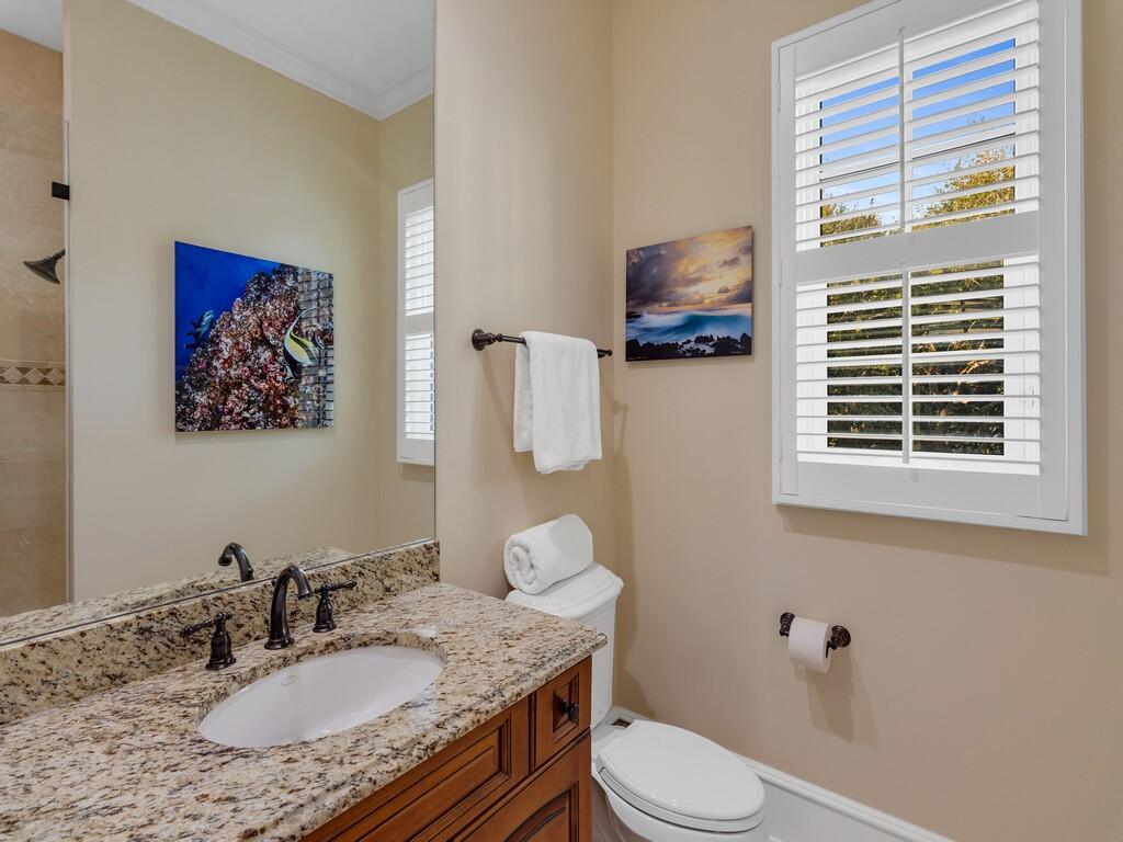400 Oceanview Lane Vero Beach, FL 32963 - Photo 47 of 59 a bathroom with a granite countertop toilet sink and mirror