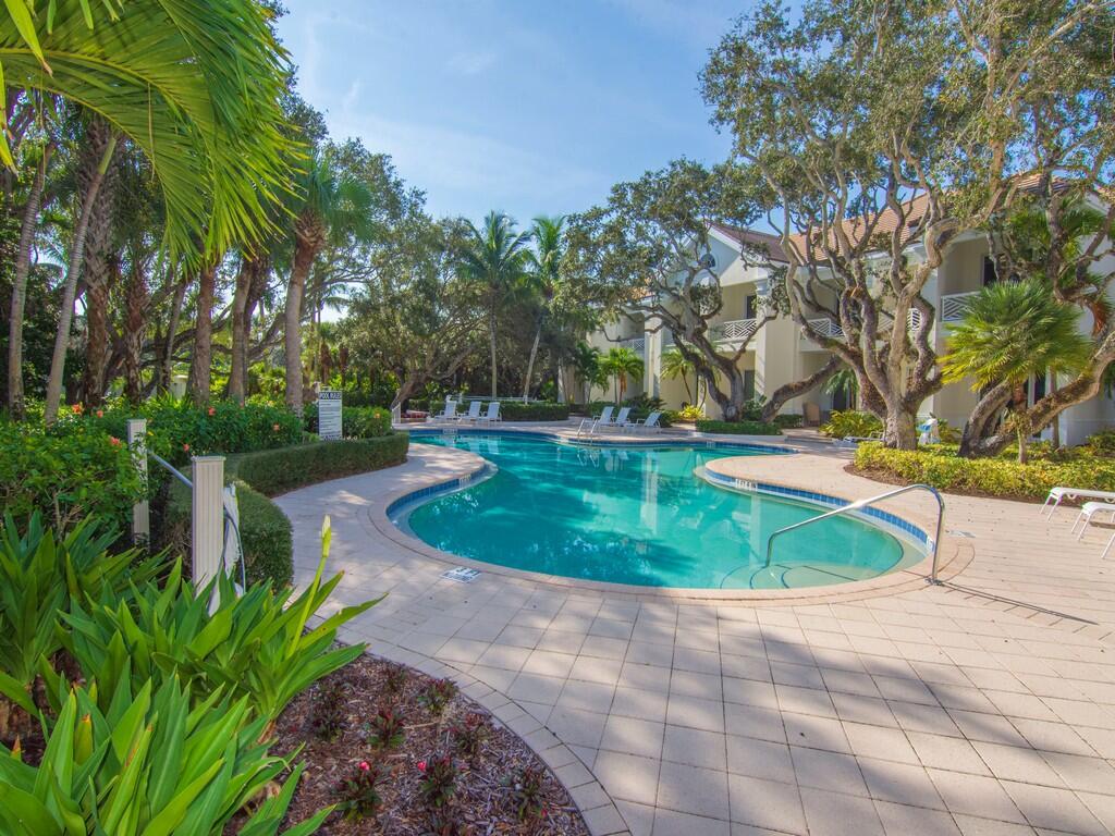 400 Oceanview Lane Vero Beach, FL 32963 - Photo 52 of 59 a view of a swimming pool with a yard and trees