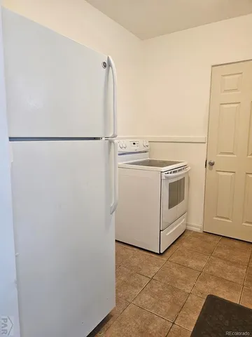 a view of a storage & utility room with washer and dryer