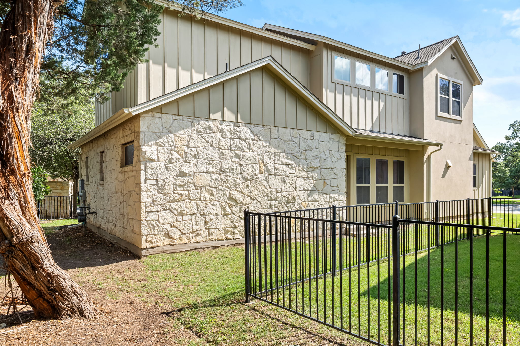 2516 Hopsack Mills Road Austin, TX 78748 - Photo 33 of 39 Exterior featuring stone veneer and vertical siding accents
