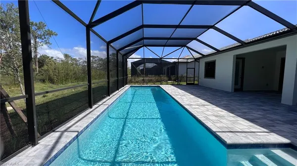 a view of swimming pool with a patio