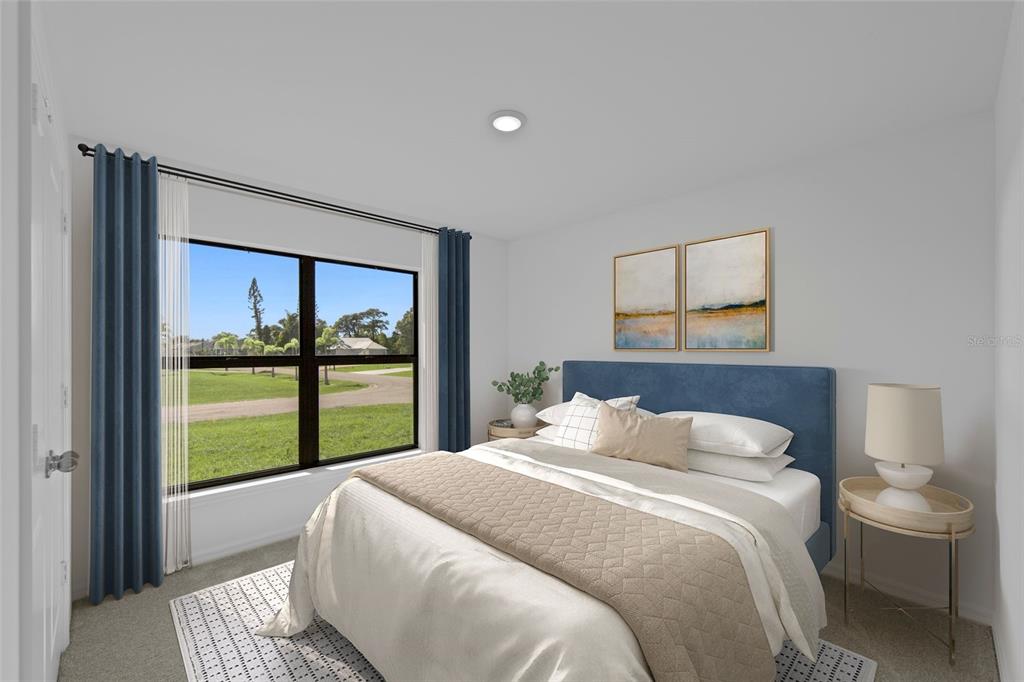 6285 Marcum Street Englewood, FL 34224 - Photo 14 of 15 a bedroom with a large bed and a large window