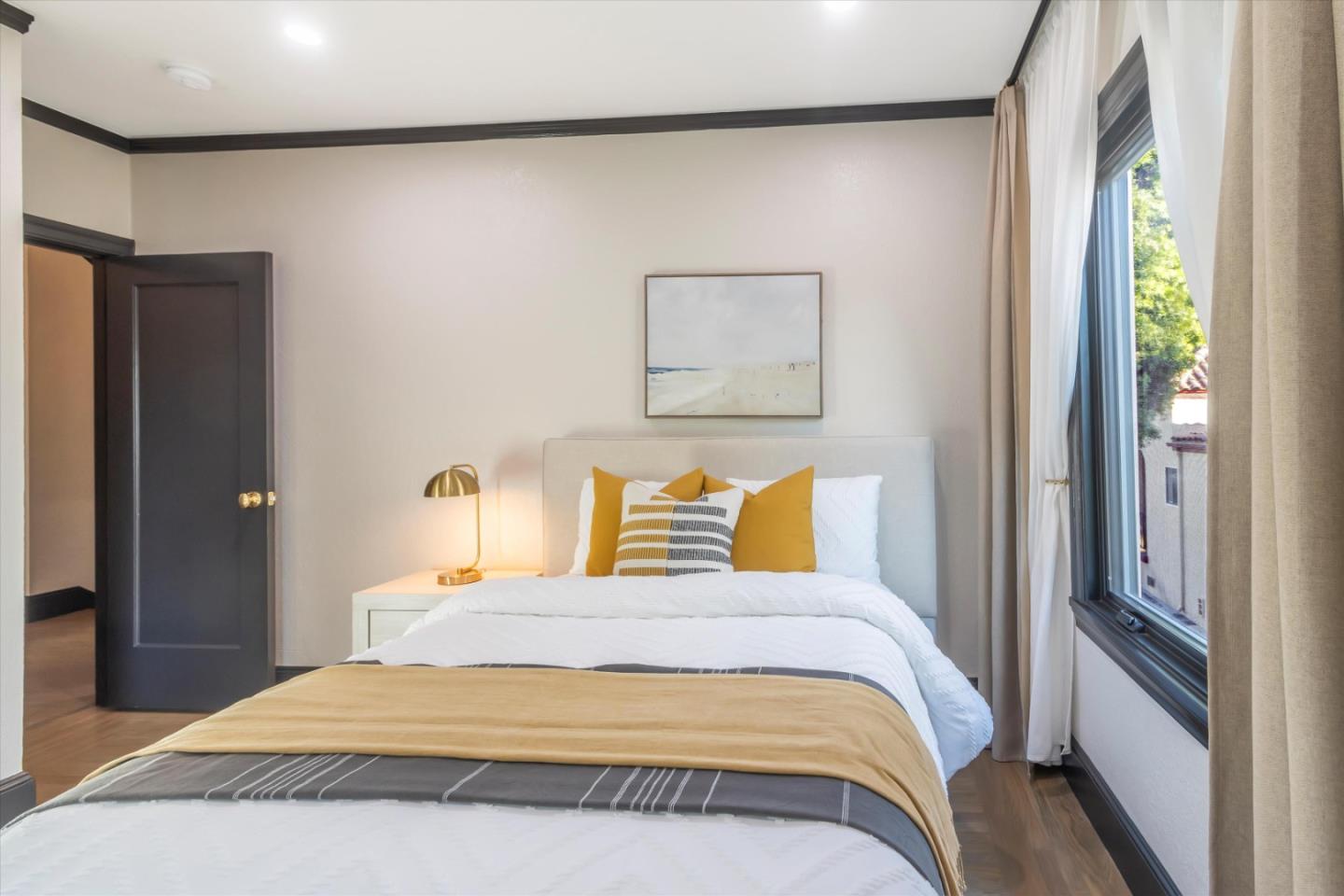 1821 Yale Drive Alameda, CA 94501 - Photo 27 of 74 a bedroom with a bed and wooden floor