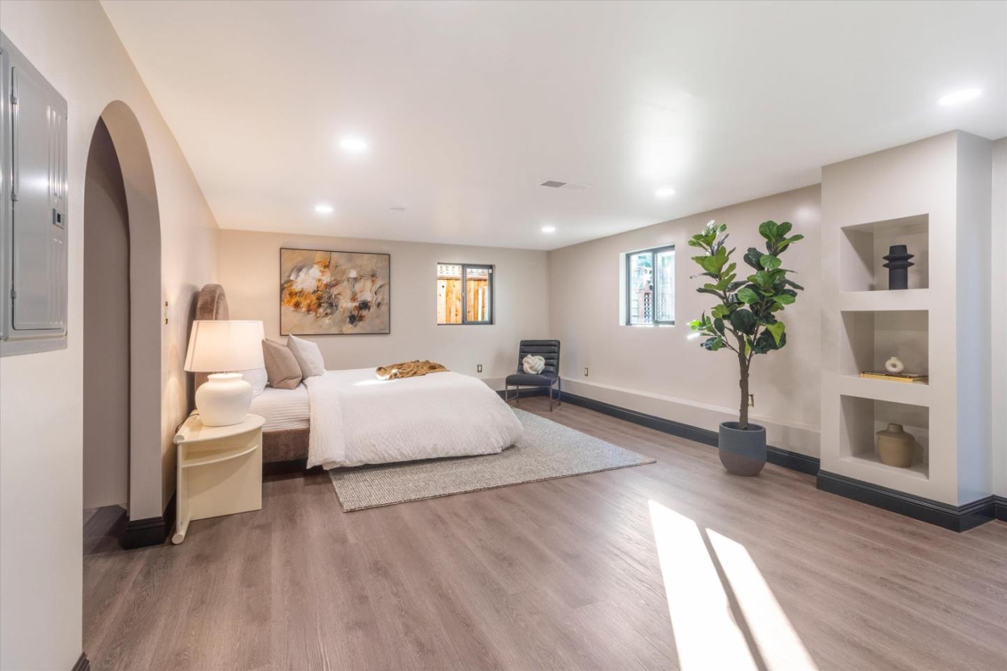1821 Yale Drive Alameda, CA 94501 - Photo 36 of 74 a spacious bedroom with a bed and a potted plant