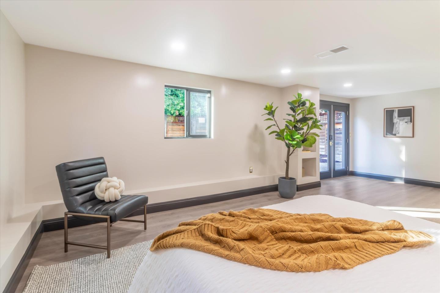 1821 Yale Drive Alameda, CA 94501 - Photo 42 of 74 a bedroom with a bed and a potted plant