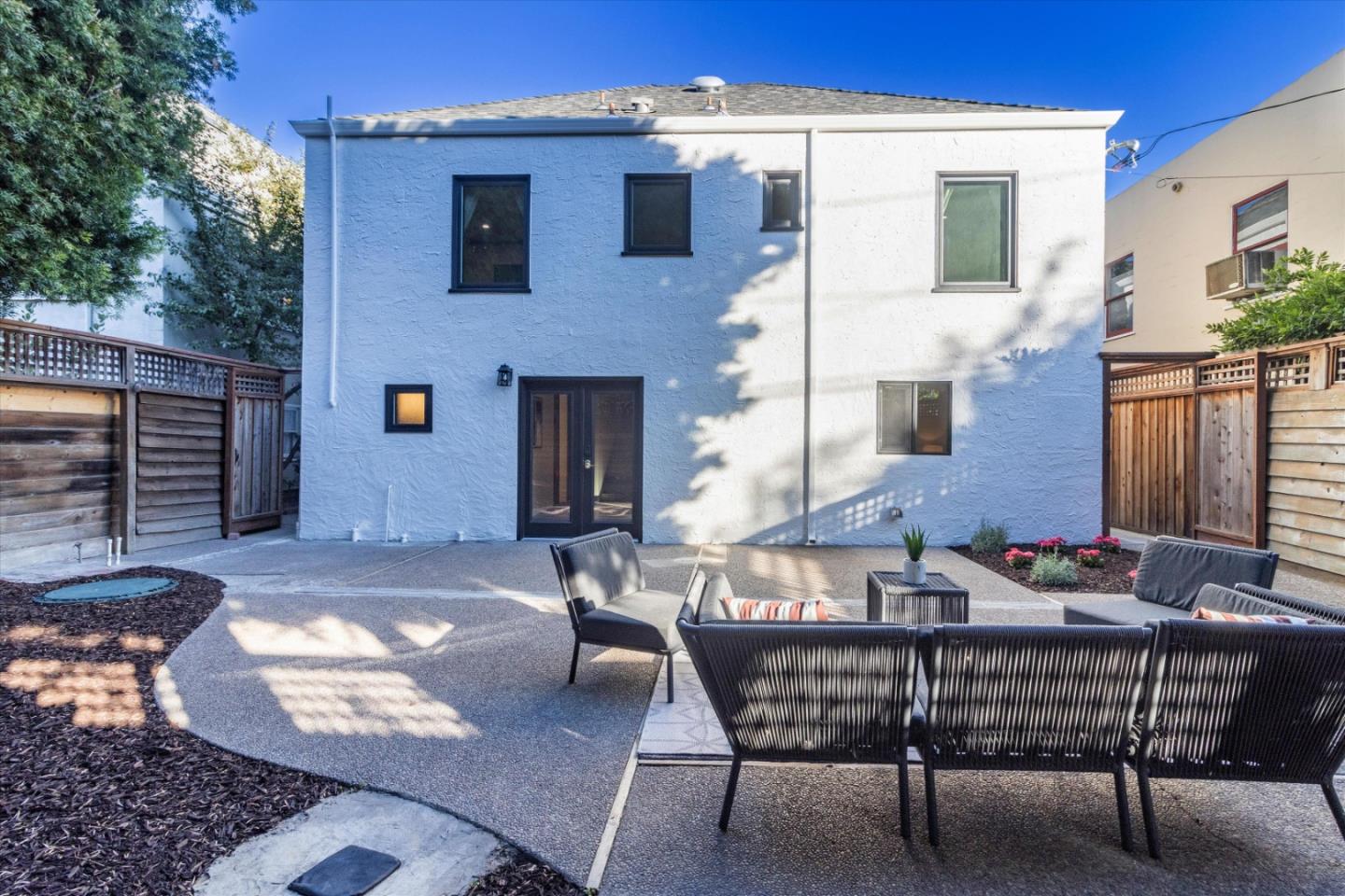 1821 Yale Drive Alameda, CA 94501 - Photo 53 of 74 a view of a patio with table and chairs with wooden floor and fence