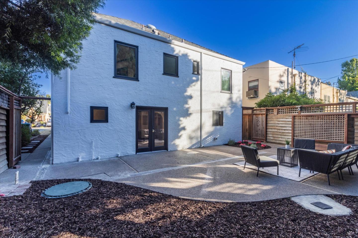 1821 Yale Drive Alameda, CA 94501 - Photo 55 of 74 a view of a patio with table and chairs with wooden floor and fence