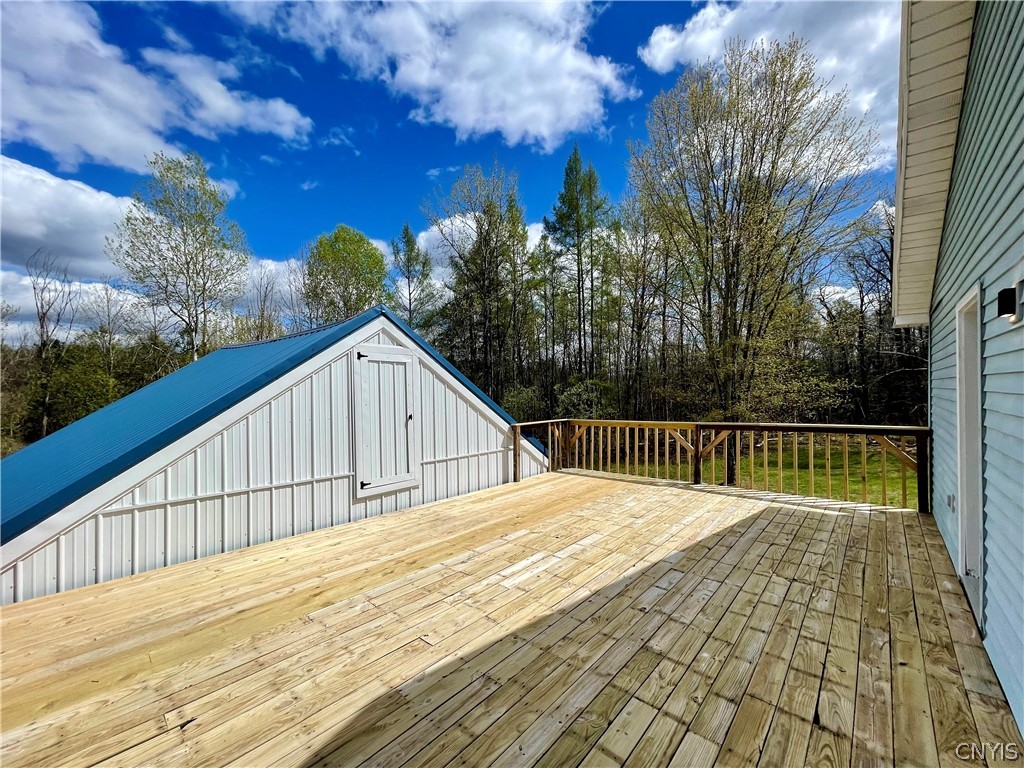 650 A E Road, Unit A De Peyster, NY 13654 - Photo 12 of 40 Elevated Deck between house & garage
