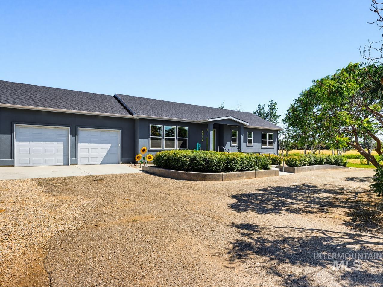 4950 West Columbia Road Nampa, ID 83687 - Photo 3 of 50 Contemporary exterior with a two-car garage