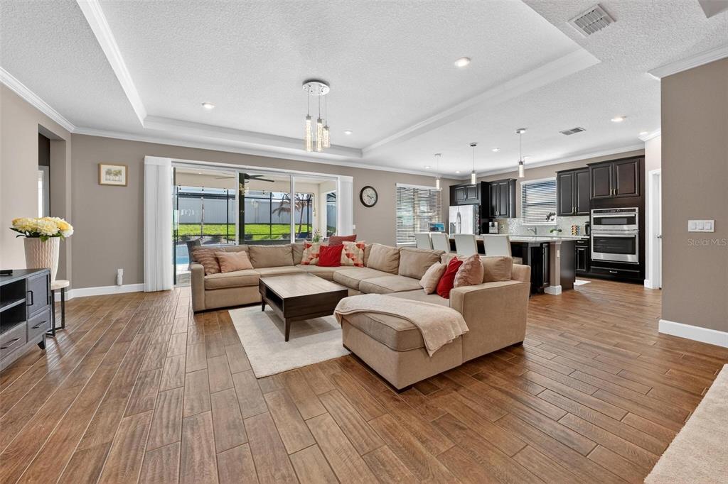 1235 Waterview Ridge Circle Apopka, FL 32703 - Photo 14 of 82 a living room with furniture and a wooden floor