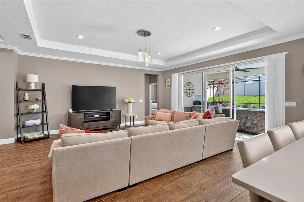 1235 Waterview Ridge Circle Apopka, FL 32703 - Photo 16 of 82 a living room with furniture and a flat screen tv