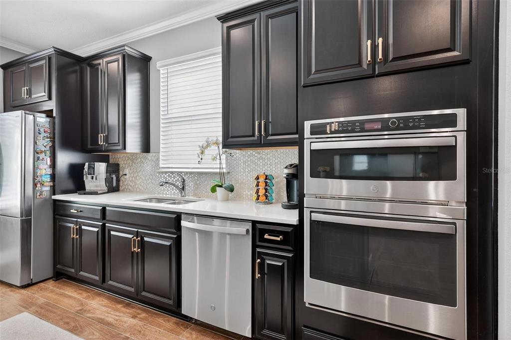 1235 Waterview Ridge Circle Apopka, FL 32703 - Photo 22 of 82 a kitchen with granite countertop cabinets stainless steel appliances and a sink