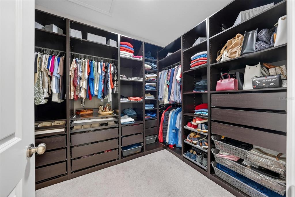 1235 Waterview Ridge Circle Apopka, FL 32703 - Photo 36 of 82 a view of walk in closet with clothes and shoes