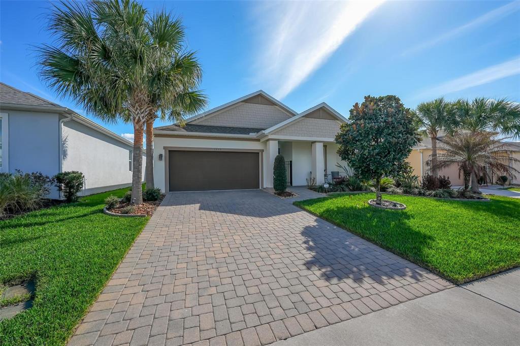 1235 Waterview Ridge Circle Apopka, FL 32703 - Photo 4 of 82 a front view of a house with a yard and potted plants