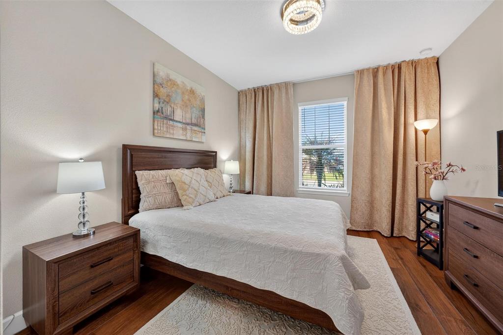 1235 Waterview Ridge Circle Apopka, FL 32703 - Photo 43 of 82 a bedroom with a bed and dresser