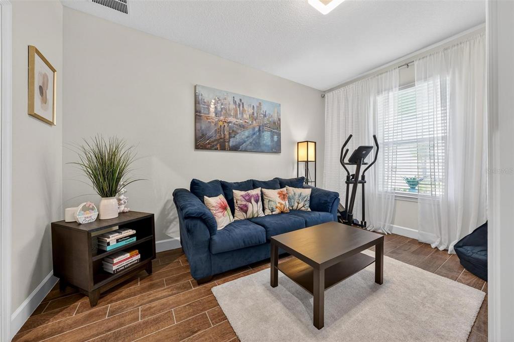 1235 Waterview Ridge Circle Apopka, FL 32703 - Photo 46 of 82 a living room with furniture and a window