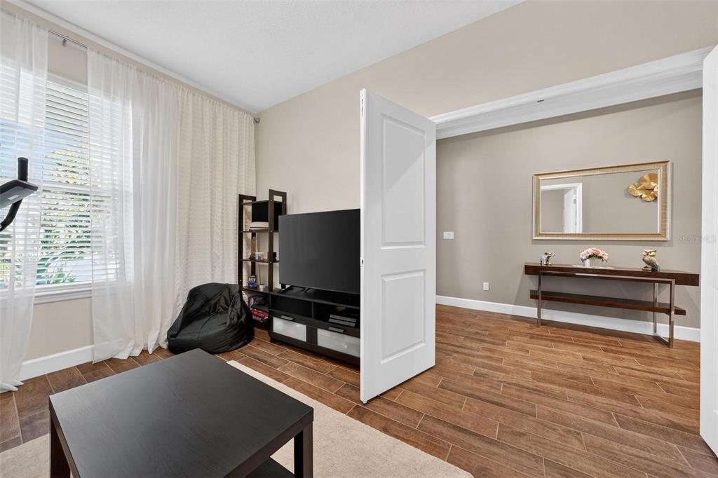 1235 Waterview Ridge Circle Apopka, FL 32703 - Photo 47 of 82 a living room with furniture and a flat screen tv