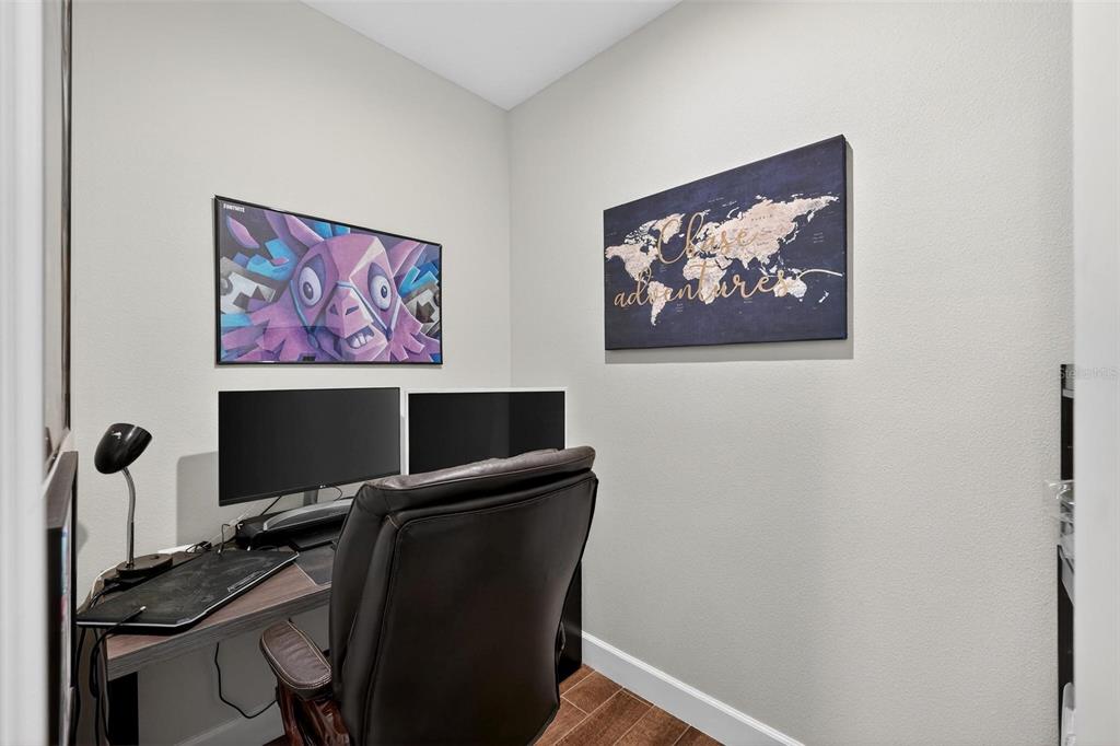 1235 Waterview Ridge Circle Apopka, FL 32703 - Photo 49 of 82 a view of a workspace with furniture and wooden floor