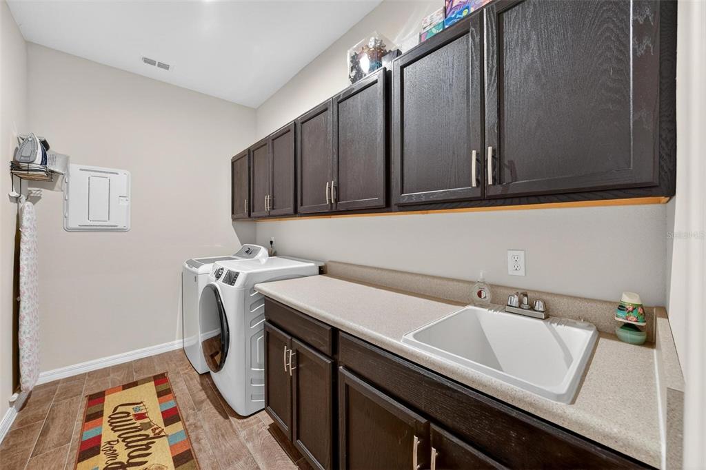1235 Waterview Ridge Circle Apopka, FL 32703 - Photo 52 of 82 a utility room with a sink
