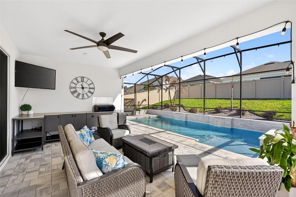 1235 Waterview Ridge Circle Apopka, FL 32703 - Photo 53 of 82 a living room with furniture a rug and a large window