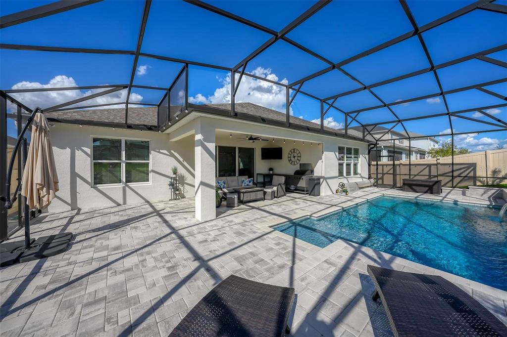 1235 Waterview Ridge Circle Apopka, FL 32703 - Photo 55 of 82 a view of a patio with table and chairs under an umbrella