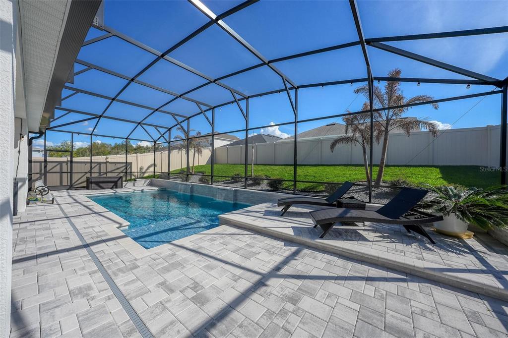 1235 Waterview Ridge Circle Apopka, FL 32703 - Photo 58 of 82 a view of a patio with a table and chairs under an umbrella