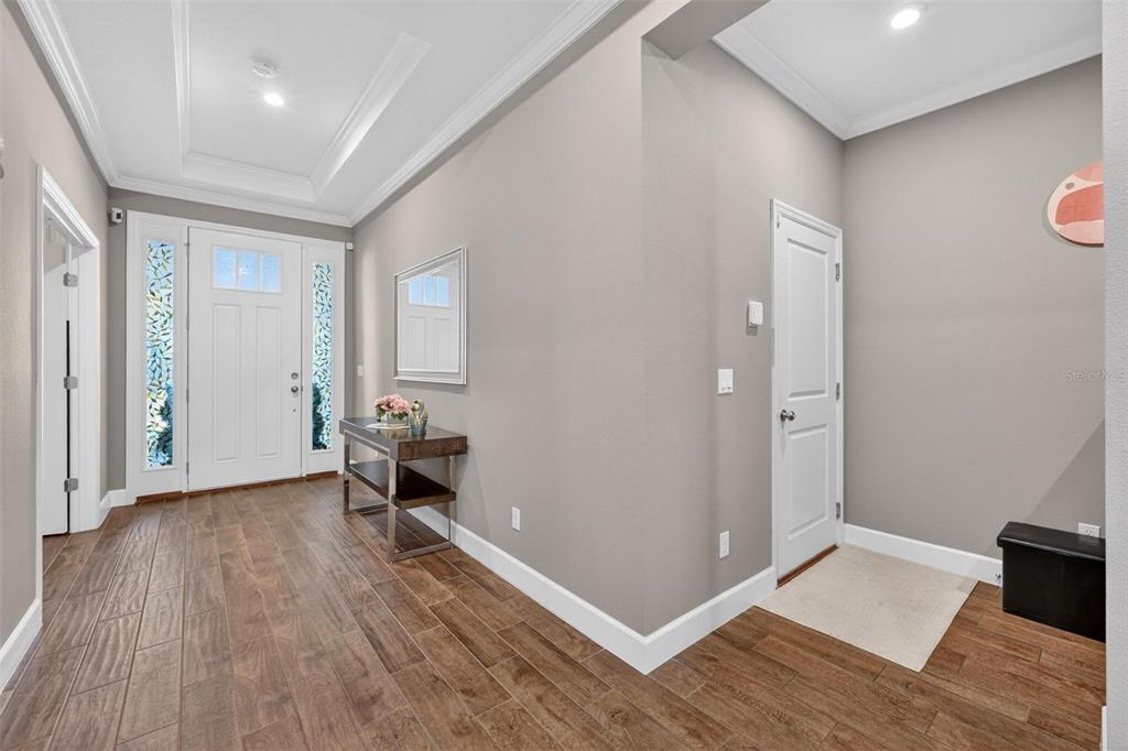 1235 Waterview Ridge Circle Apopka, FL 32703 - Photo 6 of 82 wooden floor in an empty room with a window