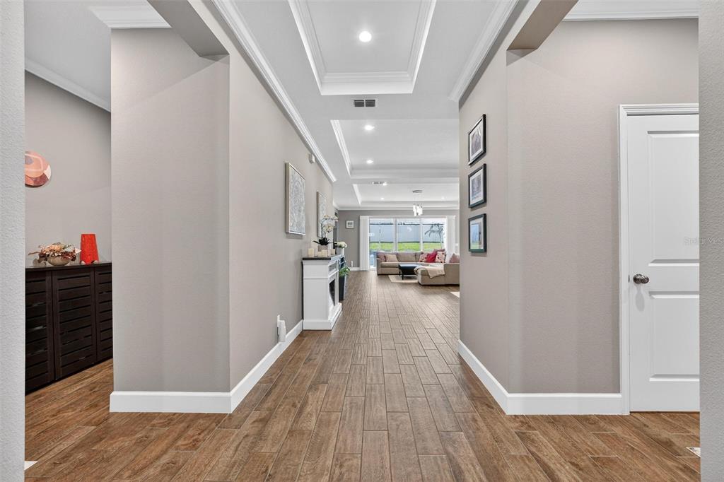 1235 Waterview Ridge Circle Apopka, FL 32703 - Photo 7 of 82 a view of a hallway view with wooden floor and staircase