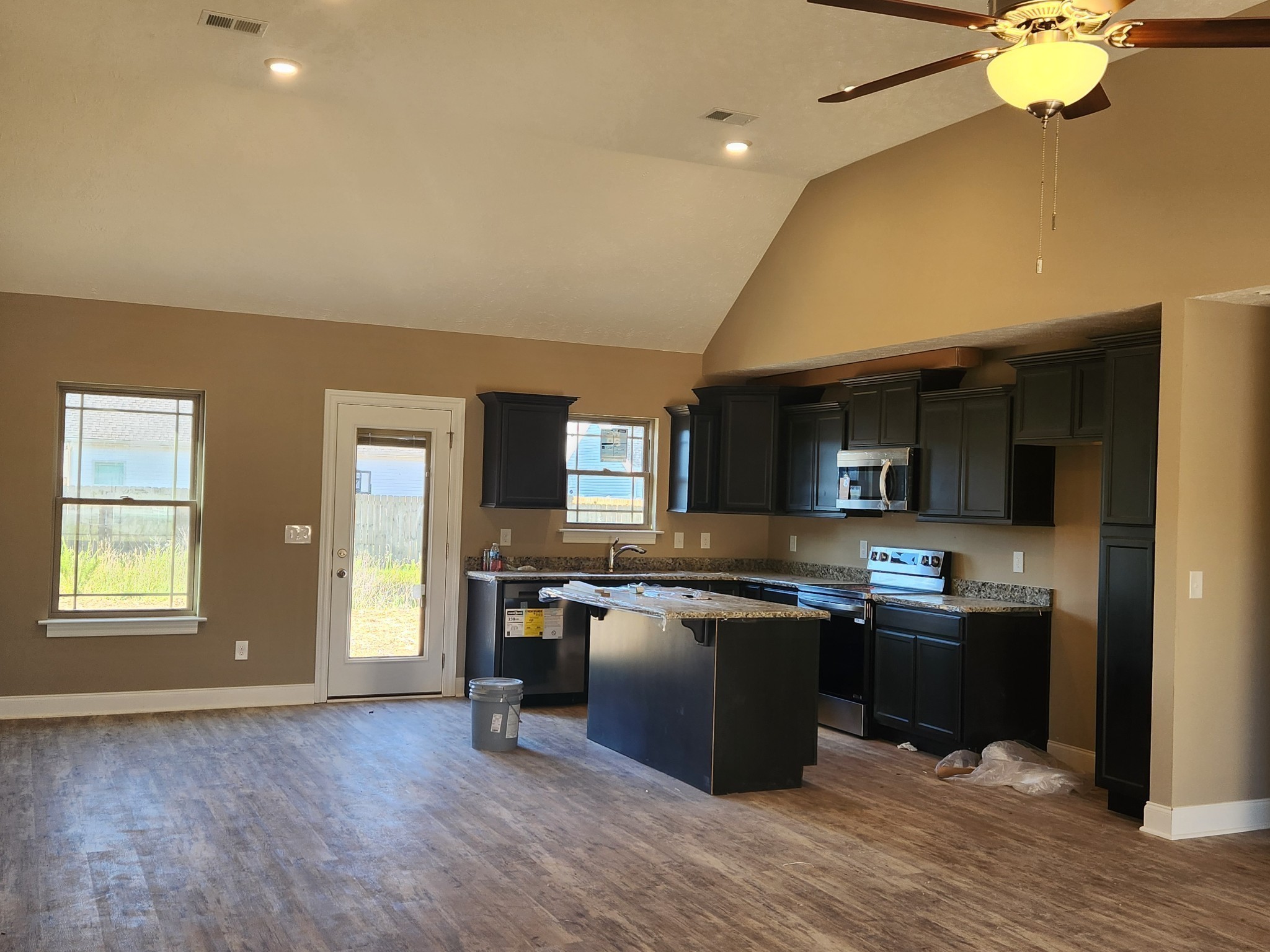 2859 Upstream Road Christiana, TN 37037 - Photo 34 of 72 a kitchen with stainless steel appliances granite countertop a sink dishwasher stove and oven with wooden floor