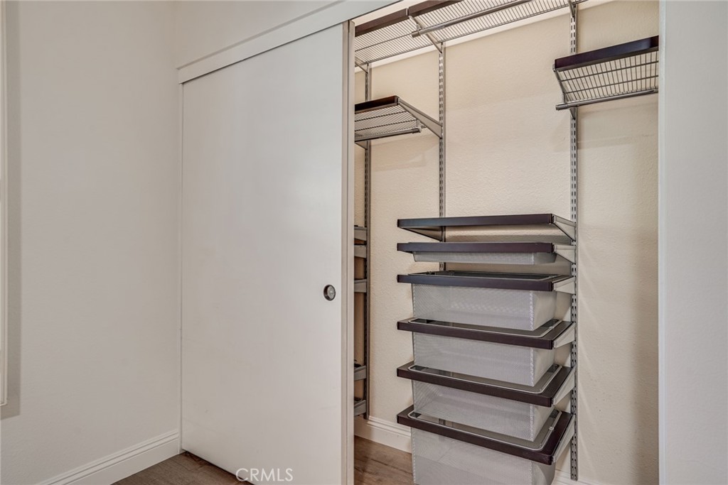 49 East Yale Loop, Unit 26 Irvine, CA 92604 - Photo 36 of 63 a view of walk in closet with empty racks