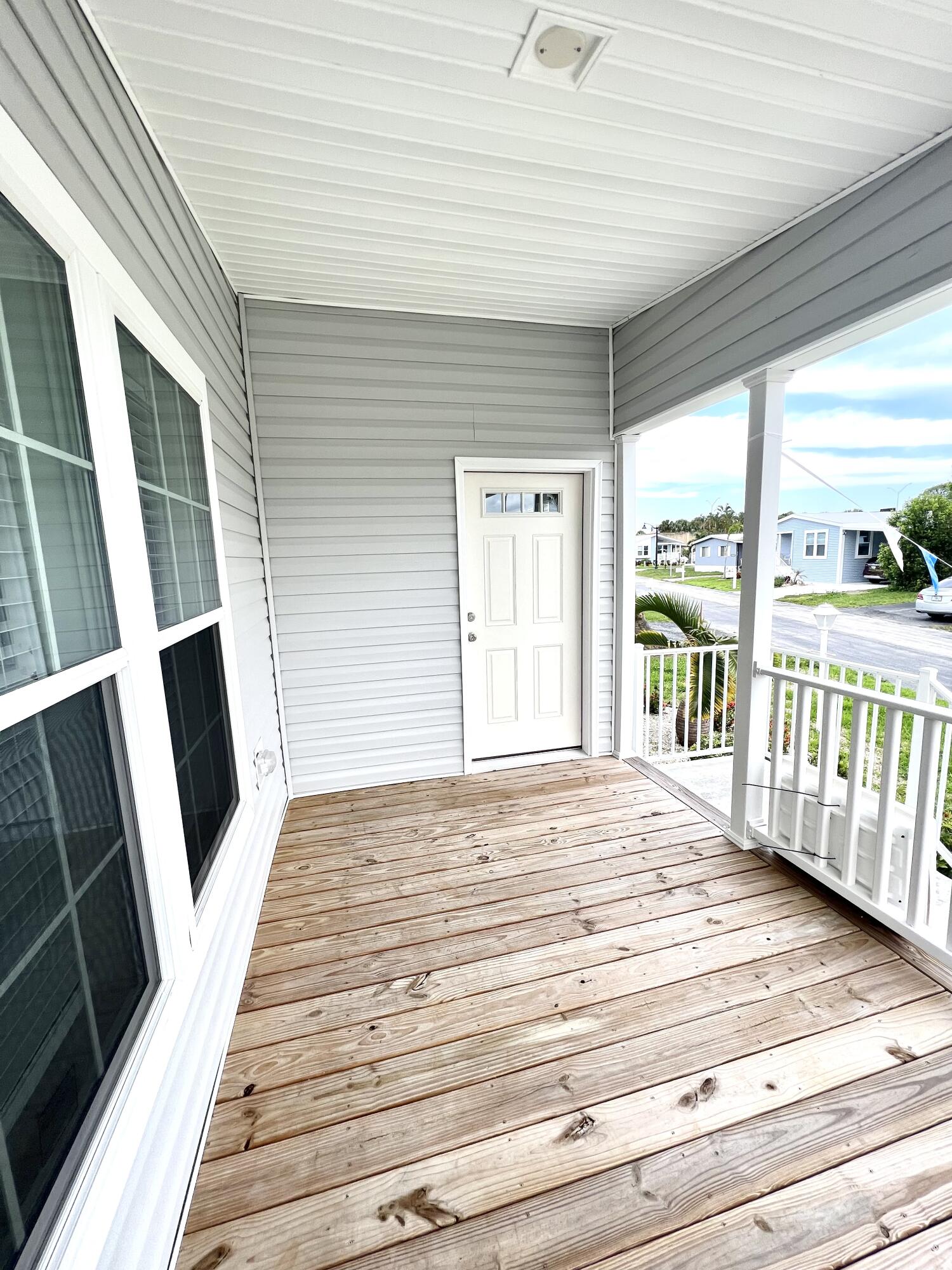 4099 74th Road North, Unit 409 West Palm Beach, FL 33404 - Photo 14 of 18 a view of a porch