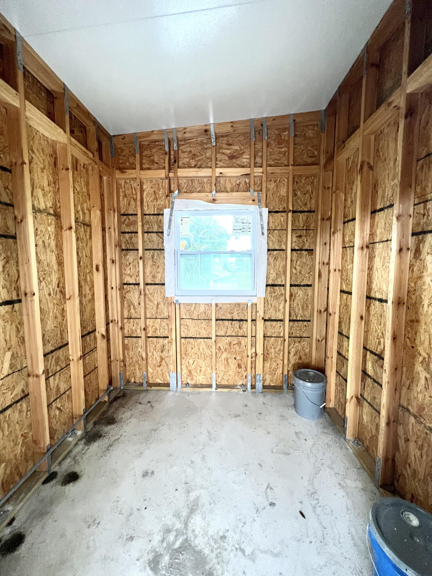 4099 74th Road North, Unit 409 West Palm Beach, FL 33404 - Photo 18 of 18 a view of walk in closet with window