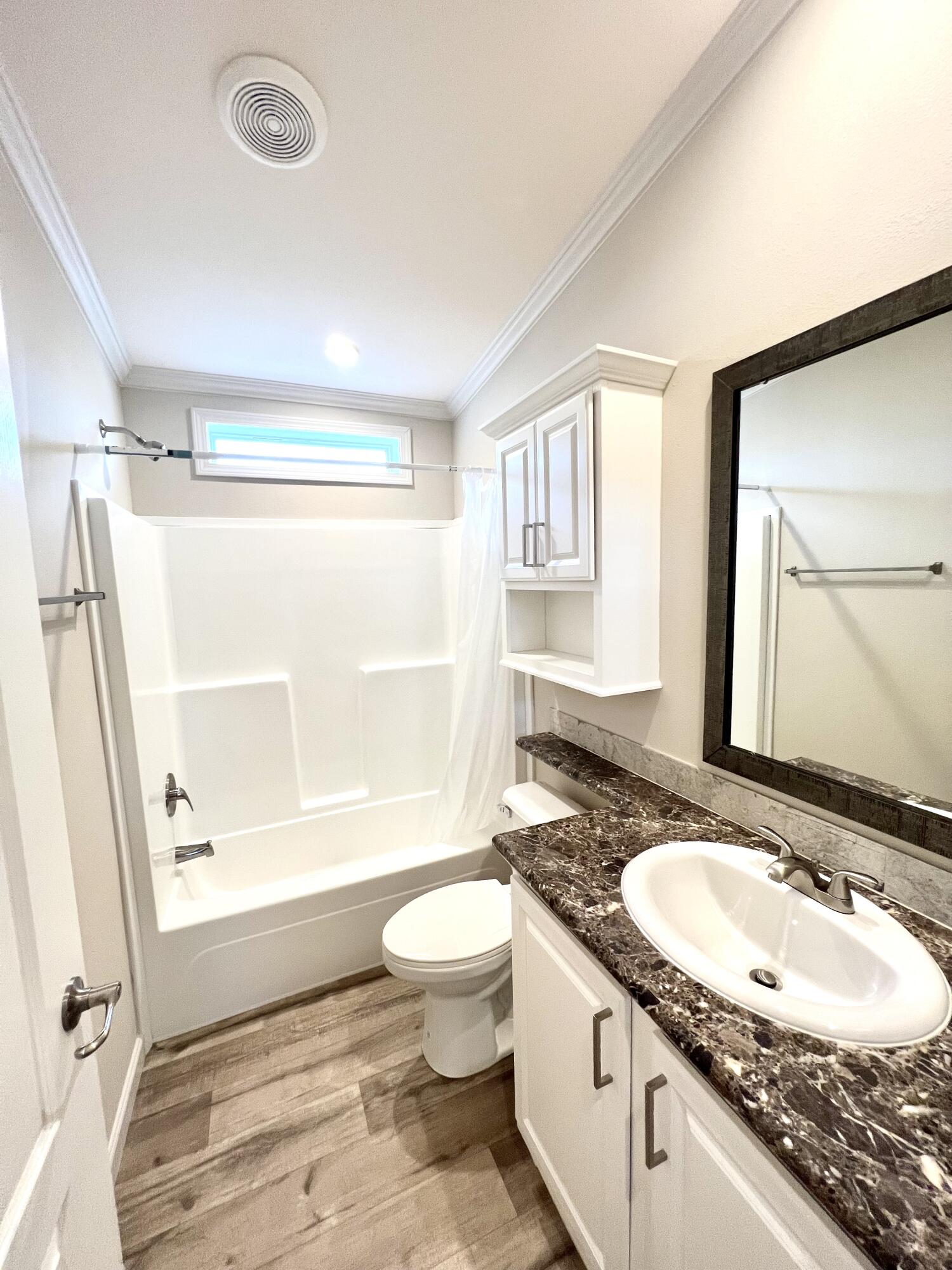 4099 74th Road North, Unit 409 West Palm Beach, FL 33404 - Photo 10 of 18 a bathroom with a granite countertop sink toilet and shower