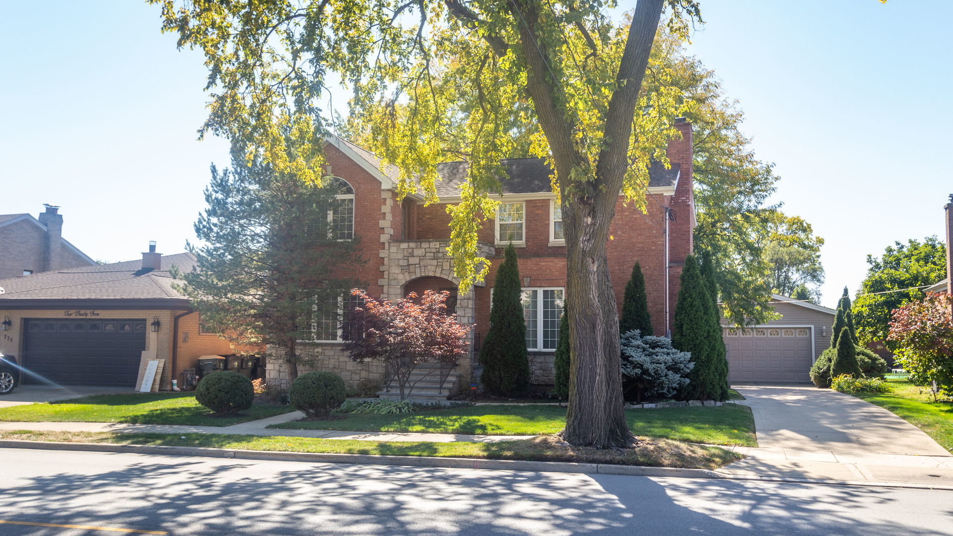 241 Devon Avenue Park Ridge, IL 60068 - Photo 1 of 46 a view of a park that has a tree in it