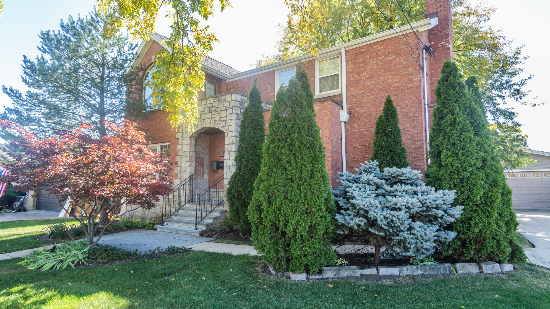 241 Devon Avenue Park Ridge, IL 60068 - Photo 2 of 46 a front view of a house with garden
