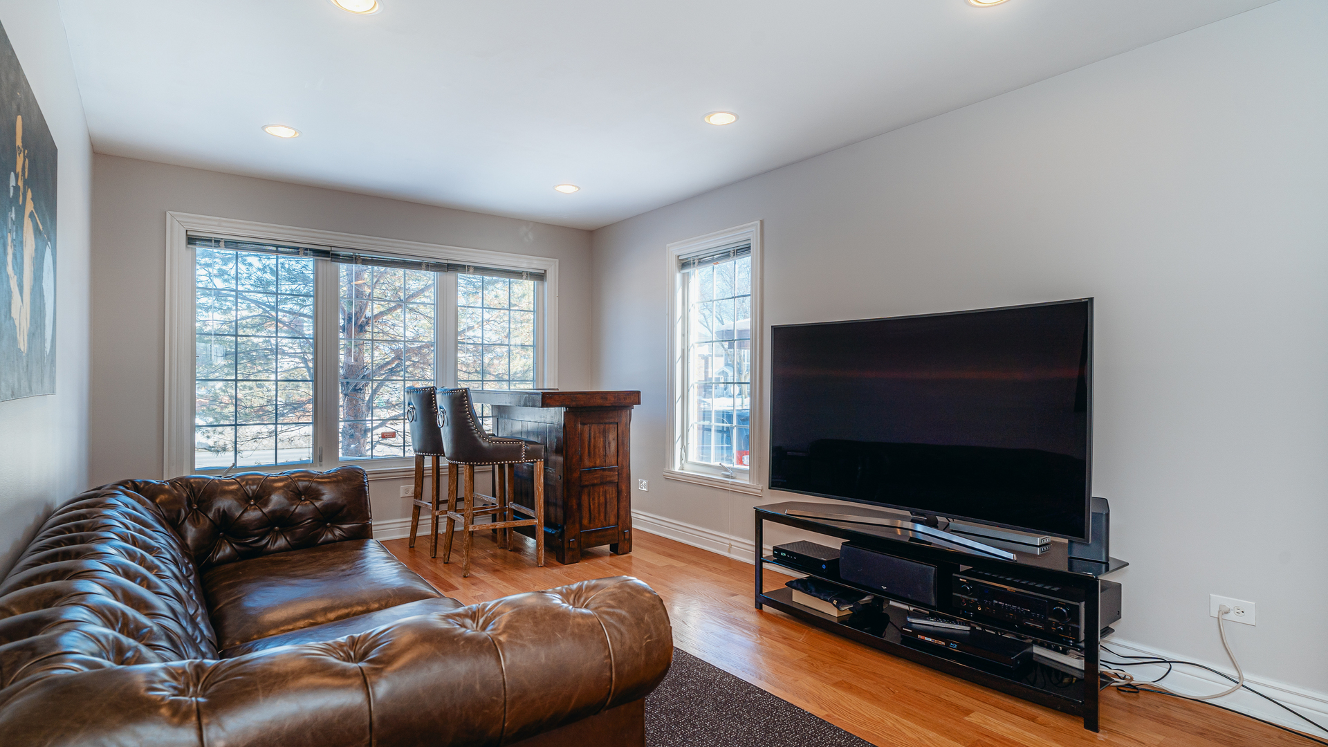 241 Devon Avenue Park Ridge, IL 60068 - Photo 13 of 46 a living room with furniture and a flat screen tv
