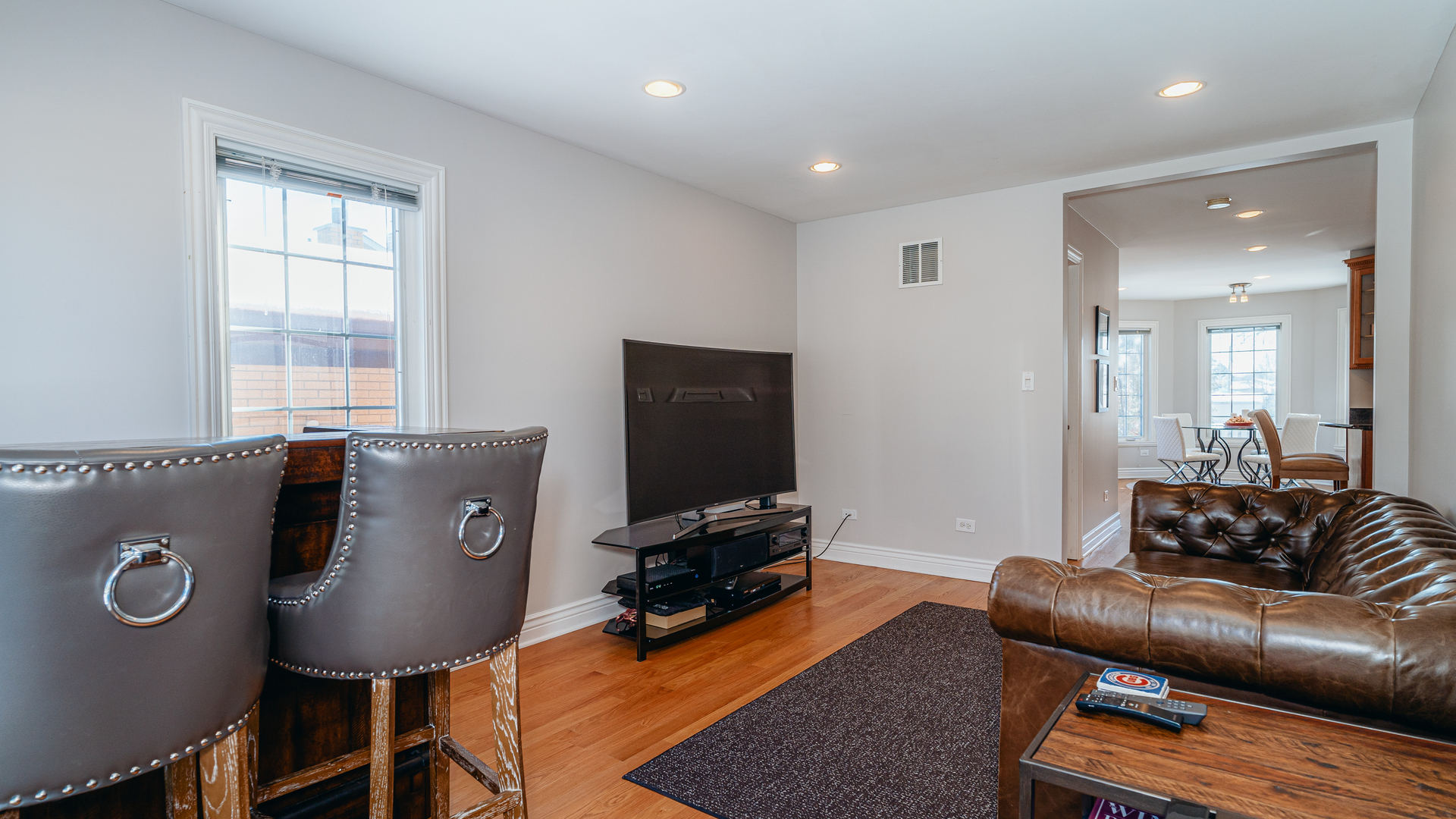 241 Devon Avenue Park Ridge, IL 60068 - Photo 14 of 46 a living room with furniture and a flat screen tv