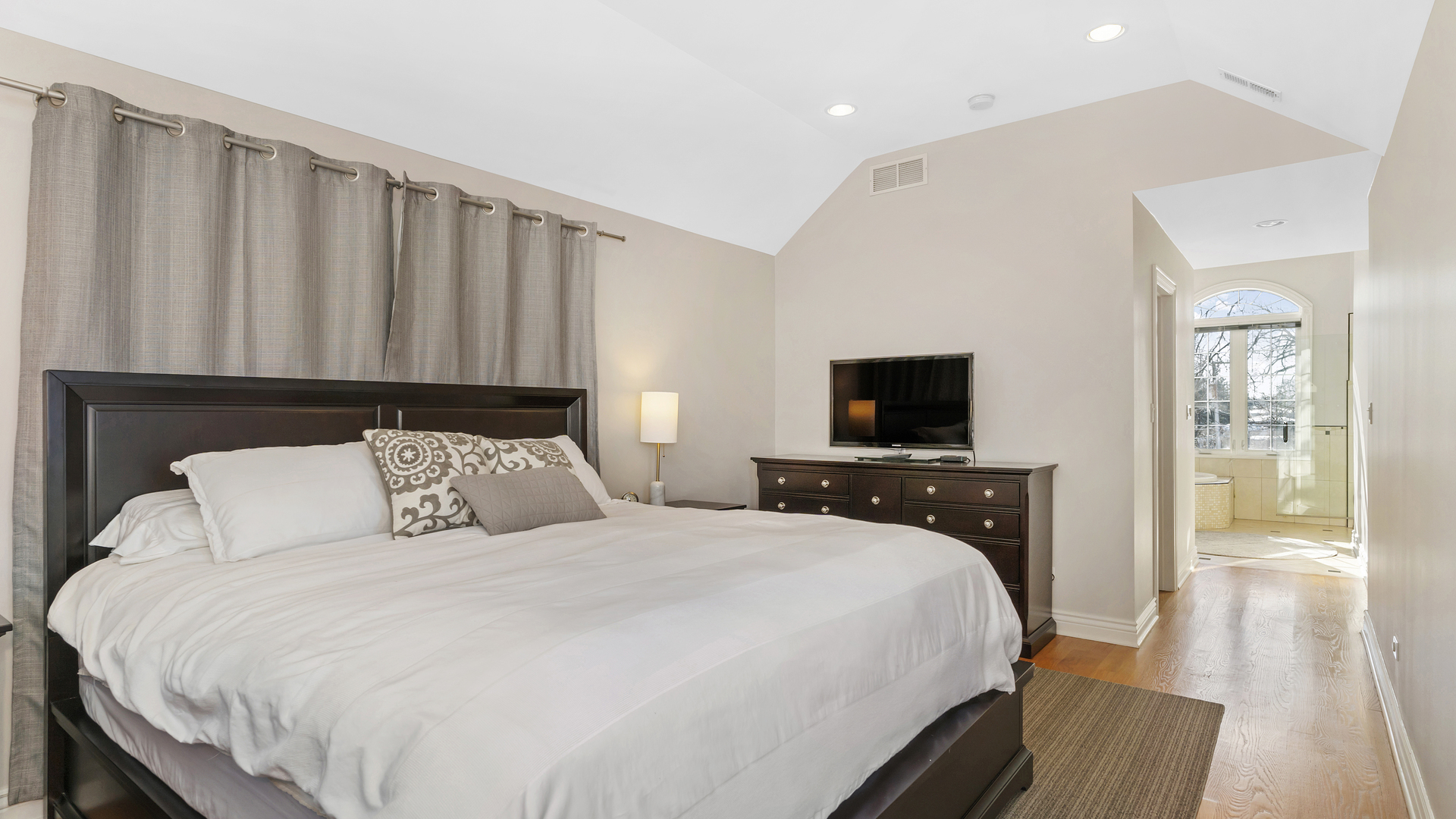 241 Devon Avenue Park Ridge, IL 60068 - Photo 20 of 46 a bedroom with a bed and a flat screen tv