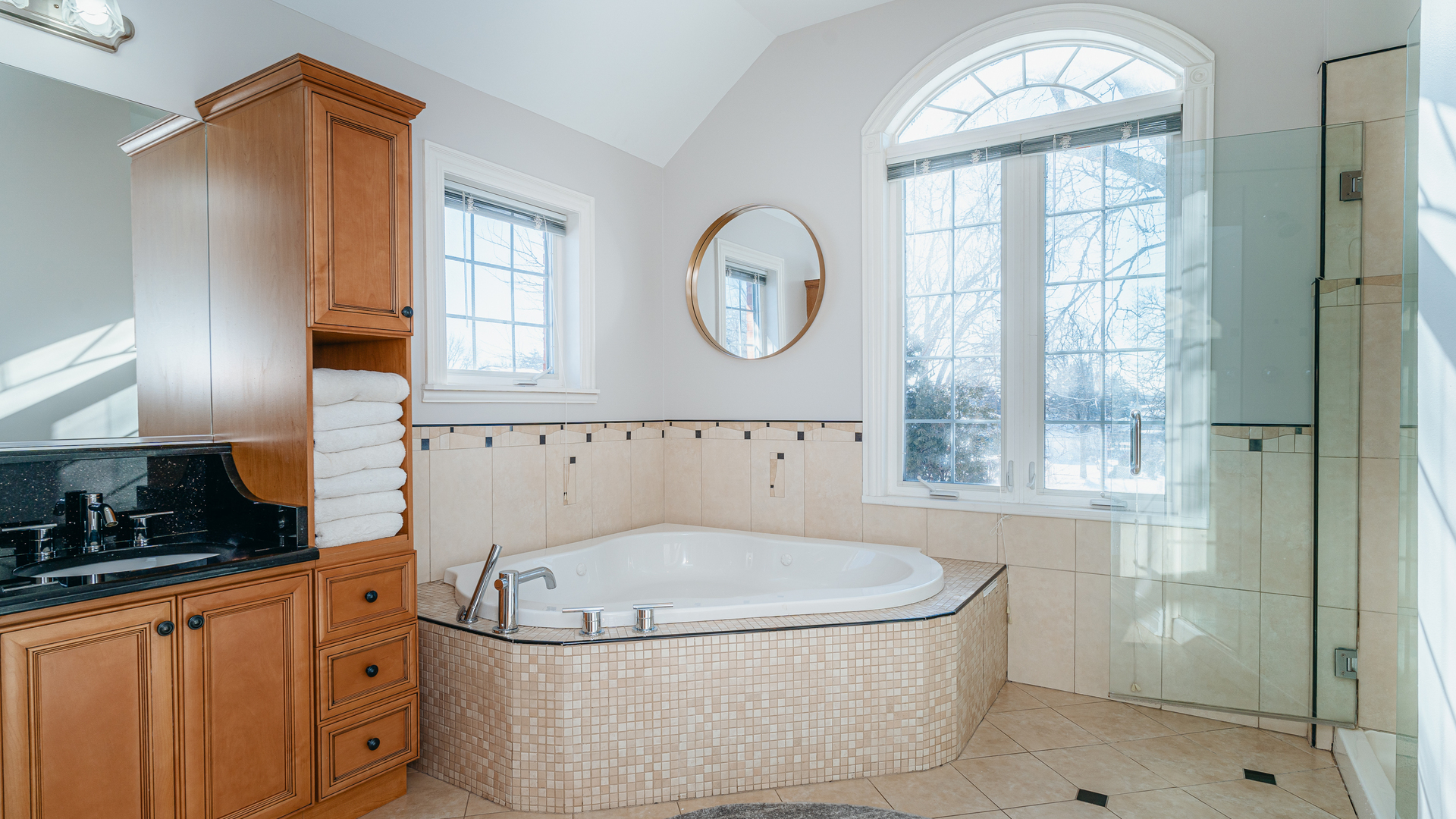 241 Devon Avenue Park Ridge, IL 60068 - Photo 22 of 46 a bathroom with a granite countertop bathtub sink and mirror