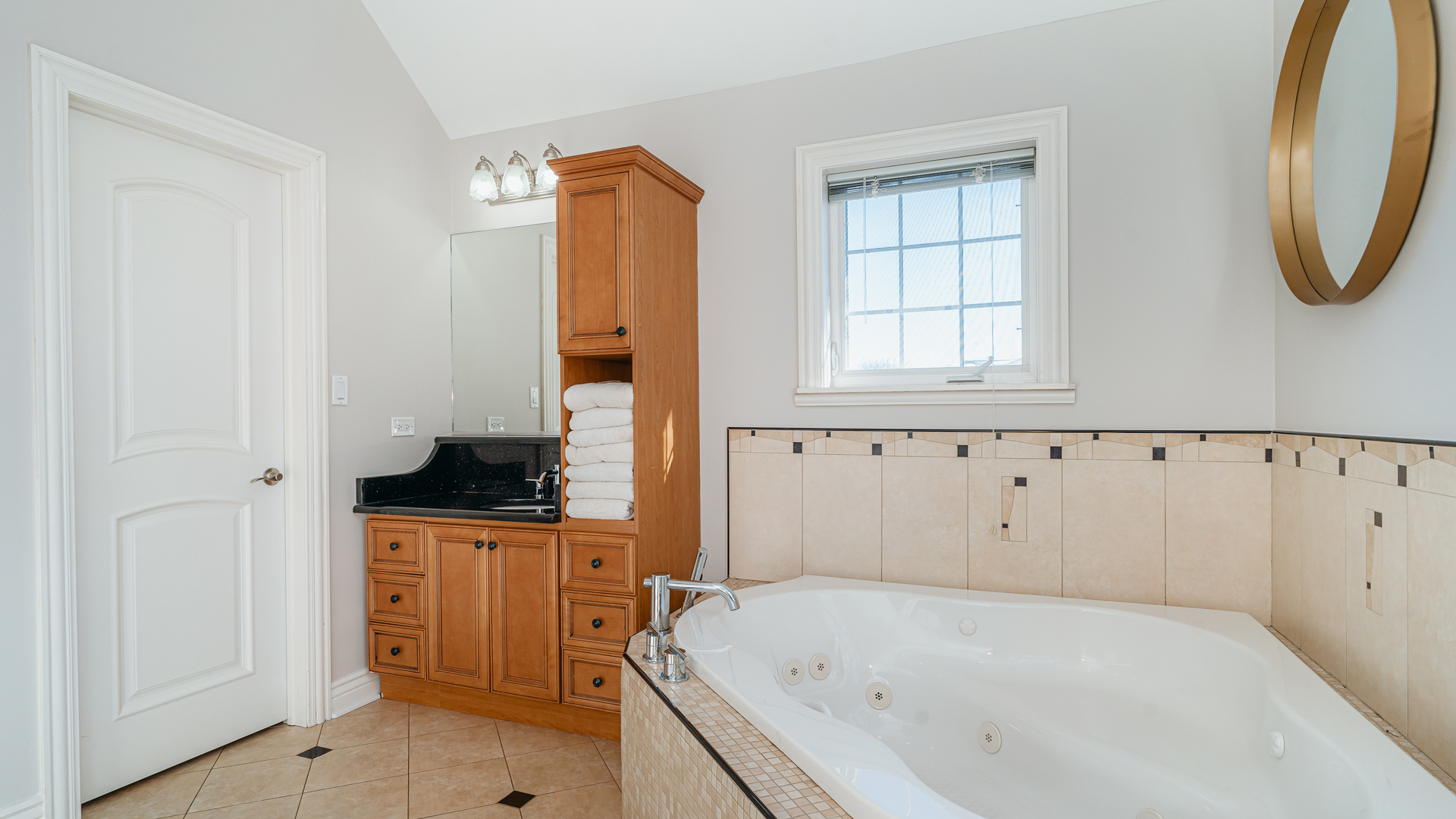241 Devon Avenue Park Ridge, IL 60068 - Photo 24 of 46 a bathroom with a bathtub and a window