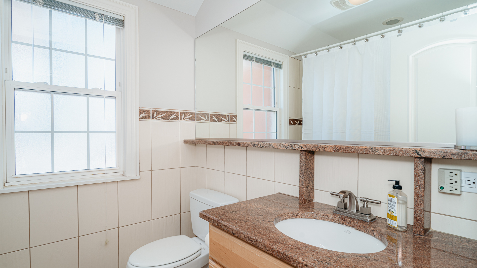 241 Devon Avenue Park Ridge, IL 60068 - Photo 30 of 46 a bathroom with a granite countertop sink and a mirror