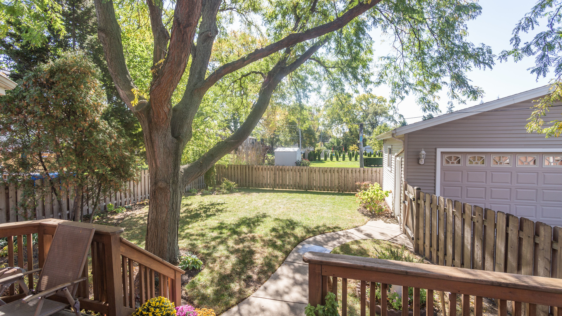241 Devon Avenue Park Ridge, IL 60068 - Photo 38 of 46 a view of a wooden deck next to a yard